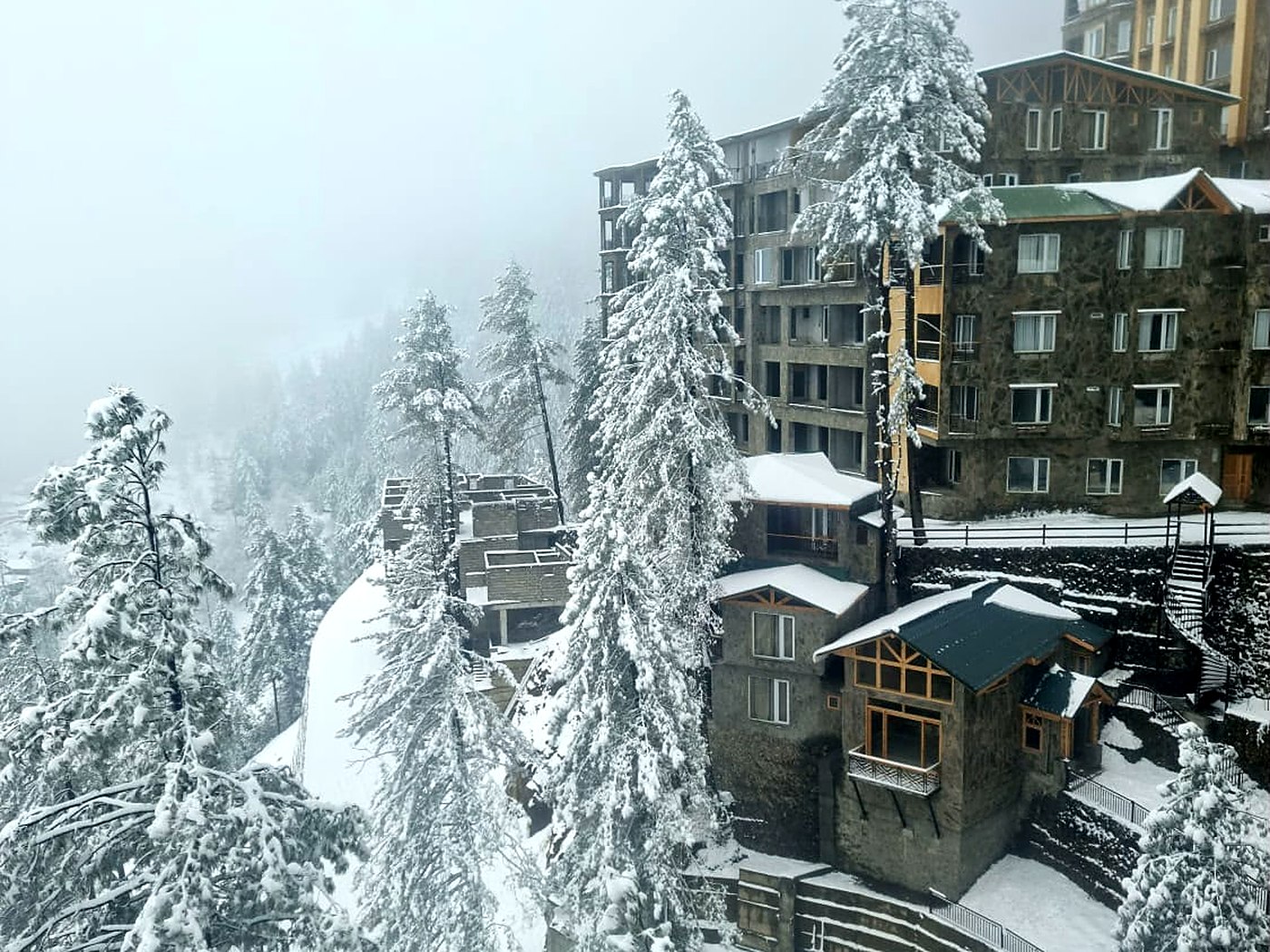 Serenity Hilltop Homes chalets and apartments in winter snow, Khaira Gali