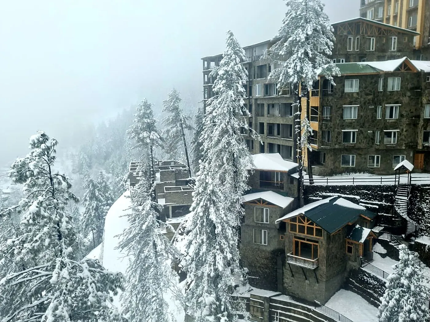 Serenity Hilltop Homes chalets and apartments in winter snow, Khaira Gali