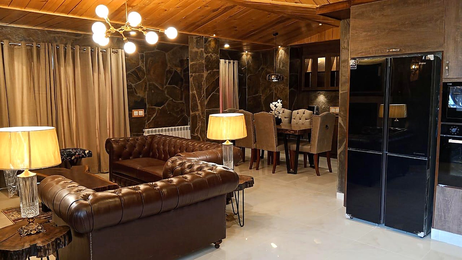 Chalet living and dining area at Serenity Hilltop Homes